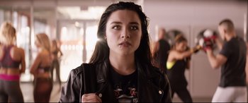 Movie still from “Fighting with My Family” (2019), directed by Stephen Merchant – A young woman wearing a black leather jacket; Close Up shot, Over the shoulder angle