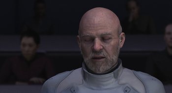 Movie still from “Final Fantasy: The Spirits Within” (2001), directed by Hironobu Sakaguchi – An older man with a bald head and beard; Close Up shot, Over the shoulder angle