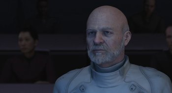 Movie still from “Final Fantasy: The Spirits Within” (2001), directed by Hironobu Sakaguchi – An old man with a beard and a white shirt; Close Up shot, Over the shoulder angle