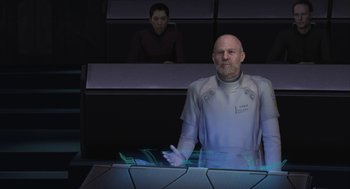 Movie still from “Final Fantasy: The Spirits Within” (2001), directed by Hironobu Sakaguchi – A man and a woman are standing in front of a computer screen; Medium shot, Over the shoulder angle