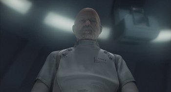 Movie still from “Final Fantasy: The Spirits Within” (2001), directed by Hironobu Sakaguchi – A bald man in a white shirt is looking at the camera; Close Up shot, Low angle