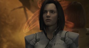 Movie still from “Final Fantasy: The Spirits Within” (2001), directed by Hironobu Sakaguchi – A woman in a white and black uniform is in front of a fire background; Close Up shot, Over the shoulder angle