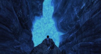 Movie still from “Final Fantasy: The Spirits Within” (2001), directed by Hironobu Sakaguchi – Two people are standing on a cliff looking down at the water; Extreme Wide shot, Overhead angle