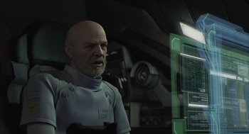 Movie still from “Final Fantasy: The Spirits Within” (2001), directed by Hironobu Sakaguchi – A bald man in a white shirt is in front of a computer screen; Close Up shot, Over the shoulder angle
