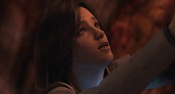 Movie still from “Final Fantasy: The Spirits Within” (2001), directed by Hironobu Sakaguchi – A woman looking up into the sky with a light shining on her face; Close Up shot, Low angle