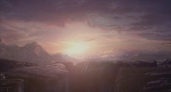 Movie still from “Final Fantasy: The Spirits Within” (2001), directed by Hironobu Sakaguchi – The sun is setting over a mountain range; Extreme Wide shot, High angle