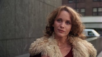 Movie still from “Fingers” (1978), directed by James Toback – A person wearing a fur coat; Close Up shot, Low angle