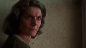 Movie still from “Fingers” (1978), directed by James Toback – A person with short black hair; Close Up shot, Low angle