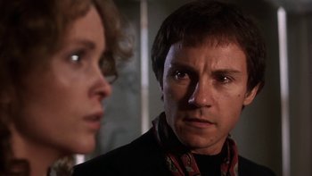 Movie still from “Fingers” (1978), directed by James Toback – A man and a woman looking at each other in a room; Close Up shot, Low angle