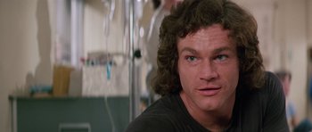 Movie still from “Firestarter” (1984), directed by Mark L. Lester – A person with long hair; Close Up shot, Low angle