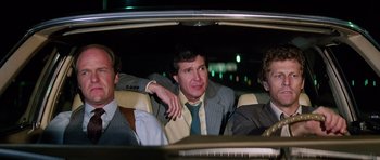 Movie still from “Firestarter” (1984), directed by Mark L. Lester – Three men sitting in the back seat of a car at night; Medium shot, Low angle