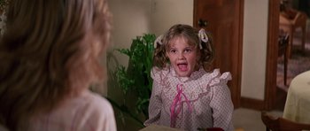 Movie still from “Firestarter” (1984), directed by Mark L. Lester – A little girl in a pink and white nightgown; Close Up shot, Low angle