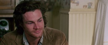 Movie still from “Firestarter” (1984), directed by Mark L. Lester – A person wearing a jacket; Close Up shot, Over the shoulder angle