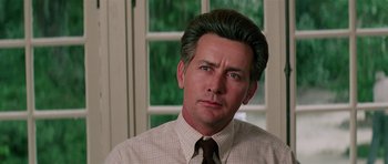 Movie still from “Firestarter” (1984), directed by Mark L. Lester – A person wearing a shirt and a tie; Close Up shot, Low angle