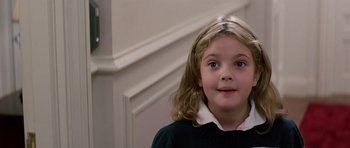 Movie still from “Firestarter” (1984), directed by Mark L. Lester – A young girl is smiling for the camera; Close Up shot, High angle