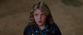 Movie still from “Firestarter” (1984), directed by Mark L. Lester – A young girl with a surprised look on her face; Close Up shot, High angle