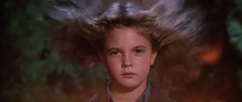 Movie still from “Firestarter” (1984), directed by Mark L. Lester – A young girl with long blonde hair in the wind; Close Up shot, Low angle
