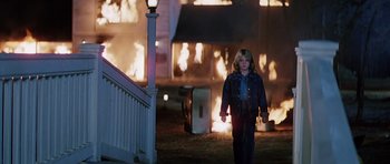 Movie still from “Firestarter” (1984), directed by Mark L. Lester – A young child walking in front of a fire; Wide shot, High angle