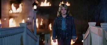 Movie still from “Firestarter” (1984), directed by Mark L. Lester – A young girl standing in front of a street light; Medium shot, High angle