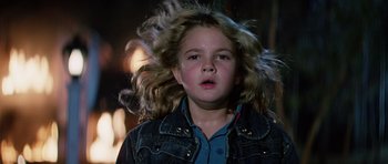 Movie still from “Firestarter” (1984), directed by Mark L. Lester – A young girl with long blonde hair blowing in the wind; Close Up shot, Low angle