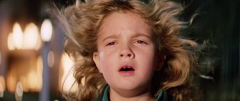 Movie still from “Firestarter” (1984), directed by Mark L. Lester – A child with long blonde hair; Close Up shot, Low angle
