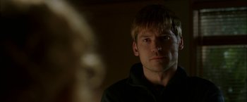 Movie still from “Firewall” (2006), directed by Richard Loncraine – A person wearing a black jacket; Close Up shot, Over the shoulder angle