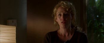 Movie still from “Firewall” (2006), directed by Richard Loncraine – A person with curly blonde hair; Close Up shot, Low angle