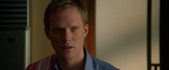 Movie still from “Firewall” (2006), directed by Richard Loncraine – A person wearing a blue shirt; Close Up shot, Over the shoulder angle