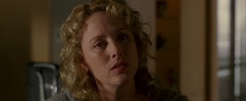 Movie still from “Firewall” (2006), directed by Richard Loncraine – A person with curly hair; Close Up shot, Over the shoulder angle