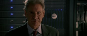 Movie still from “Firewall” (2006), directed by Richard Loncraine – A person wearing a suit and tie; Close Up shot, Low angle