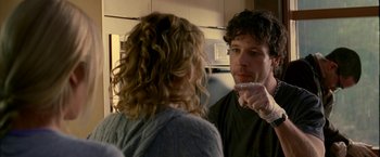 Movie still from “Firewall” (2006), directed by Richard Loncraine – A man and a woman are talking in a kitchen; Close Up shot, Over the shoulder angle