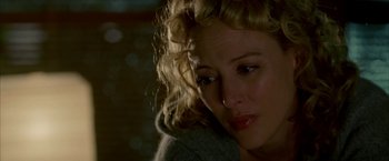 Movie still from “Firewall” (2006), directed by Richard Loncraine – A person with curly hair; Close Up shot, Over the shoulder angle
