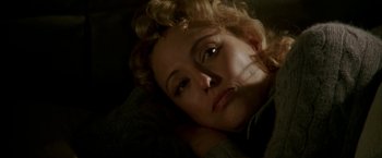 Movie still from “Firewall” (2006), directed by Richard Loncraine – A person laying on the ground; Close Up shot, High angle