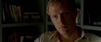 Movie still from “Firewall” (2006), directed by Richard Loncraine – A person wearing a white shirt; Close Up shot, Over the shoulder angle