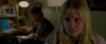 Movie still from “Firewall” (2006), directed by Richard Loncraine – A person sitting in front of a window; Close Up shot, Over the shoulder angle