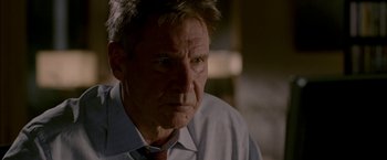 Movie still from “Firewall” (2006), directed by Richard Loncraine – An older man wearing a shirt and a tie; Close Up shot, Over the shoulder angle