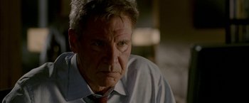 Movie still from “Firewall” (2006), directed by Richard Loncraine – An older man wearing a shirt and a tie; Close Up shot, Over the shoulder angle