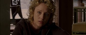 Movie still from “Firewall” (2006), directed by Richard Loncraine – A person with curly hair; Close Up shot, Over the shoulder angle