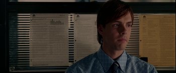 Movie still from “Firewall” (2006), directed by Richard Loncraine – A man in a blue dress shirt and a tie; Close Up shot, Over the shoulder angle