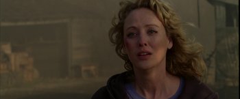 Movie still from “Firewall” (2006), directed by Richard Loncraine – A person with a bruise on her face; Close Up shot, Over the shoulder angle