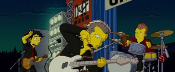 Movie still from “The Simpsons Movie” (2007), directed by David Silverman – A cartoon of a person playing a guitar; Medium shot, Low angle