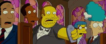 Movie still from “The Simpsons Movie” (2007), directed by David Silverman – A man in a suit holding a nintendo wii game controller; Medium shot, Low angle