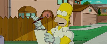 Movie still from “The Simpsons Movie” (2007), directed by David Silverman – A man holding a pen and a notepad in his hand; Medium shot, Low angle