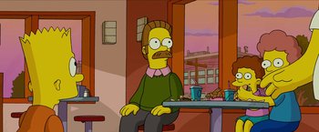 Movie still from “The Simpsons Movie” (2007), directed by David Silverman – A man sitting in front of a table with a cup of coffee on top of it; Medium shot, Low angle