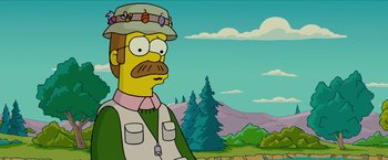 Movie still from “The Simpsons Movie” (2007), directed by David Silverman – A man with a beard wearing a hat and a jacket; Close Up shot, Low angle