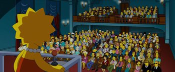 Movie still from “The Simpsons Movie” (2007), directed by David Silverman – A crowd of people sitting in front of a microphone; Extreme Wide shot, High angle
