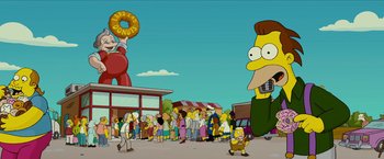 Movie still from “The Simpsons Movie” (2007), directed by David Silverman – A crowd of people standing around a donut shop; Extreme Wide shot, Low angle