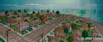 Movie still from “The Simpsons Movie” (2007), directed by David Silverman – An animated picture of a street with a lot of people on it; Extreme Wide shot, High angle