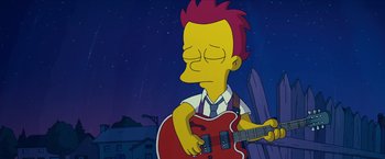 Movie still from “The Simpsons Movie” (2007), directed by David Silverman – A cartoon character is playing an electric guitar; Medium shot, High angle