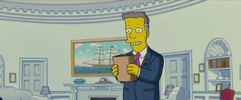 Movie still from “The Simpsons Movie” (2007), directed by David Silverman – A man in a suit and tie holding a book; Medium shot, Low angle
